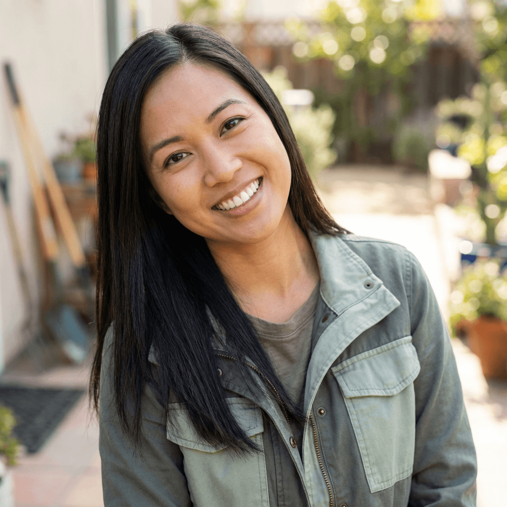 Speech-language pathologist smiling in a bright clinic therapy room